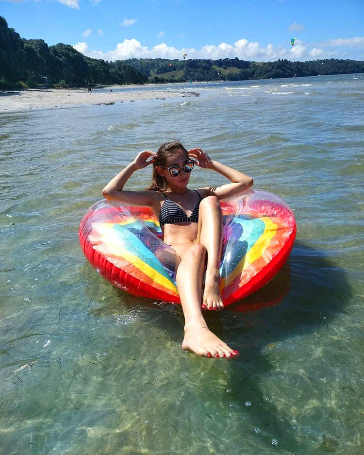 Inflatable rainbow swimming ring