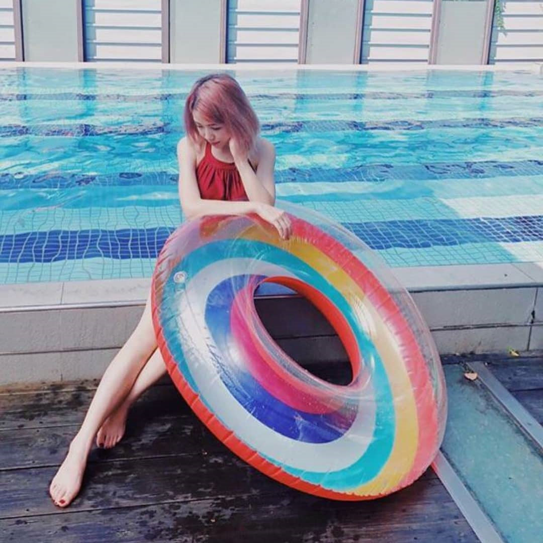 Inflatable rainbow swimming ring